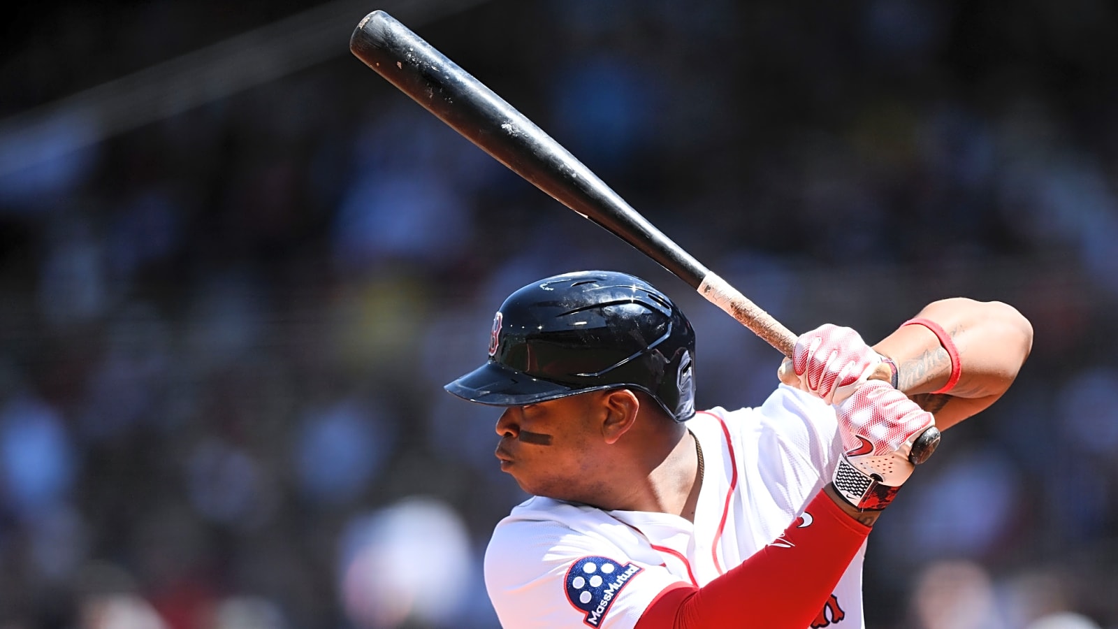 Red Sox third baseman Alex Bregman holds the bat behind him as he is poised in a batting stance against a recent 2025 MLB matchup