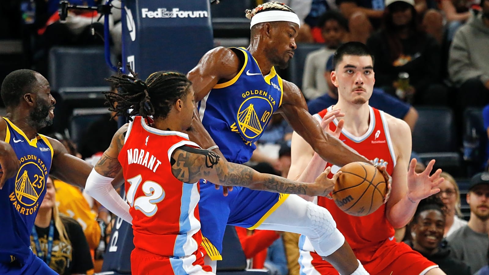Jimmy Butler III in arm as he quickly steals the ball from Ja Morant in Memphis during an early-April 2025 Memphis Grizzlies vs. Golden State Warriors matchup