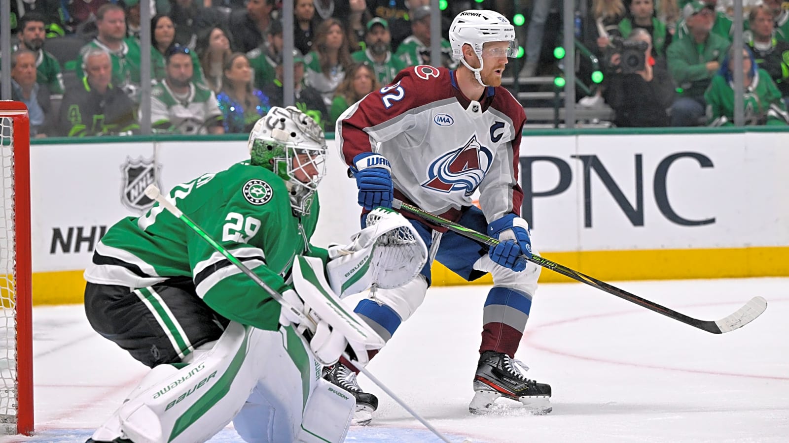 Avalanche LW Gabriel Landeskog battles for the puck in front of Stars goalie Jake Oettinger during Game 5 of the 2025 Stanley Cup Playoffs at American Airlines Center.