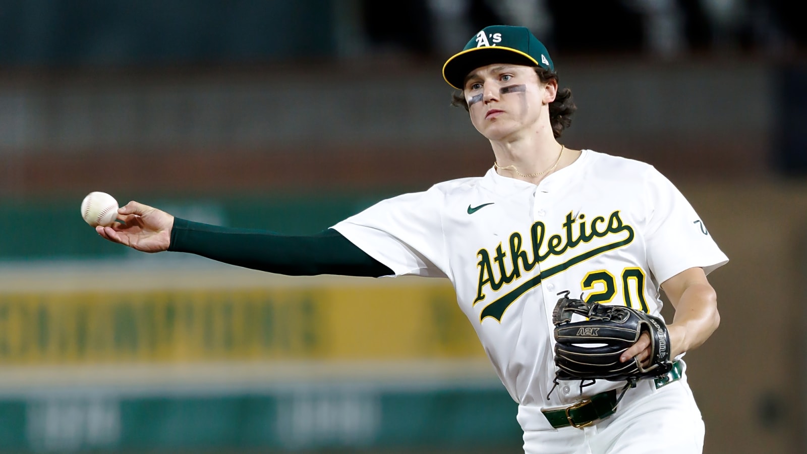 Athletics recall young infielder, designate another for assignment