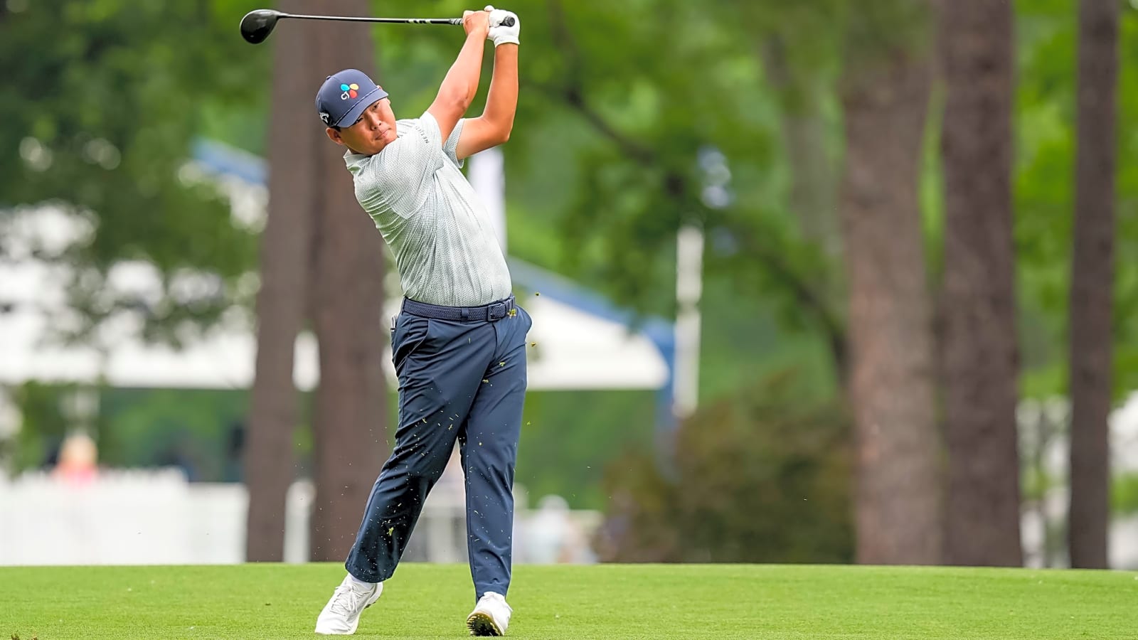 Si Woo Kim throws his club to celebrate hole-in-one