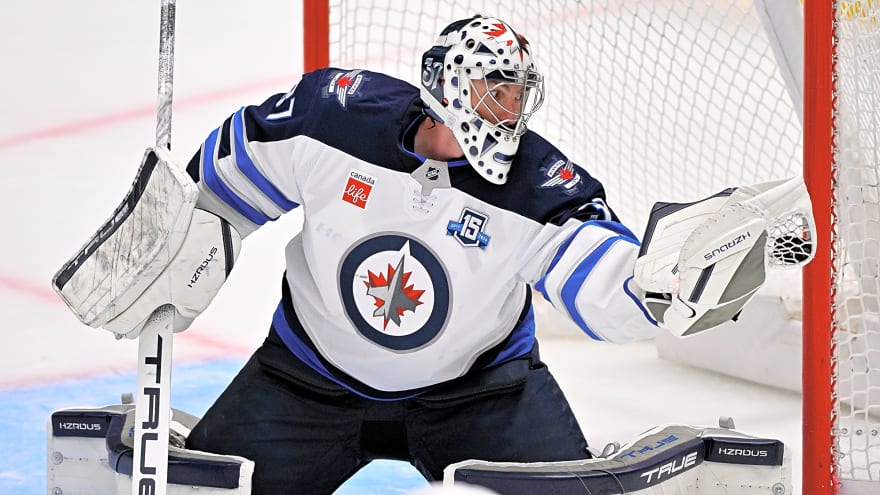 How would a Connor Hellebuyck trade compare to other historic NHL superstar goalie trades?