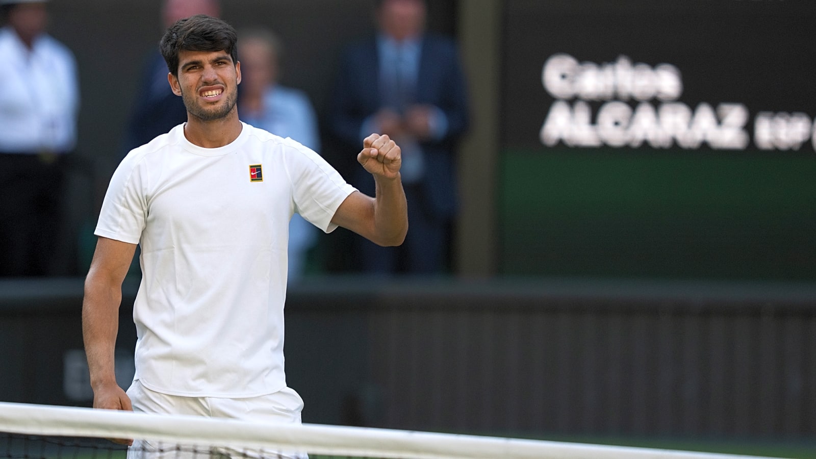 Wimbledon&#39;s reigning champion Carlos Alcaraz clinches final spot over gritty Taylor Fritz