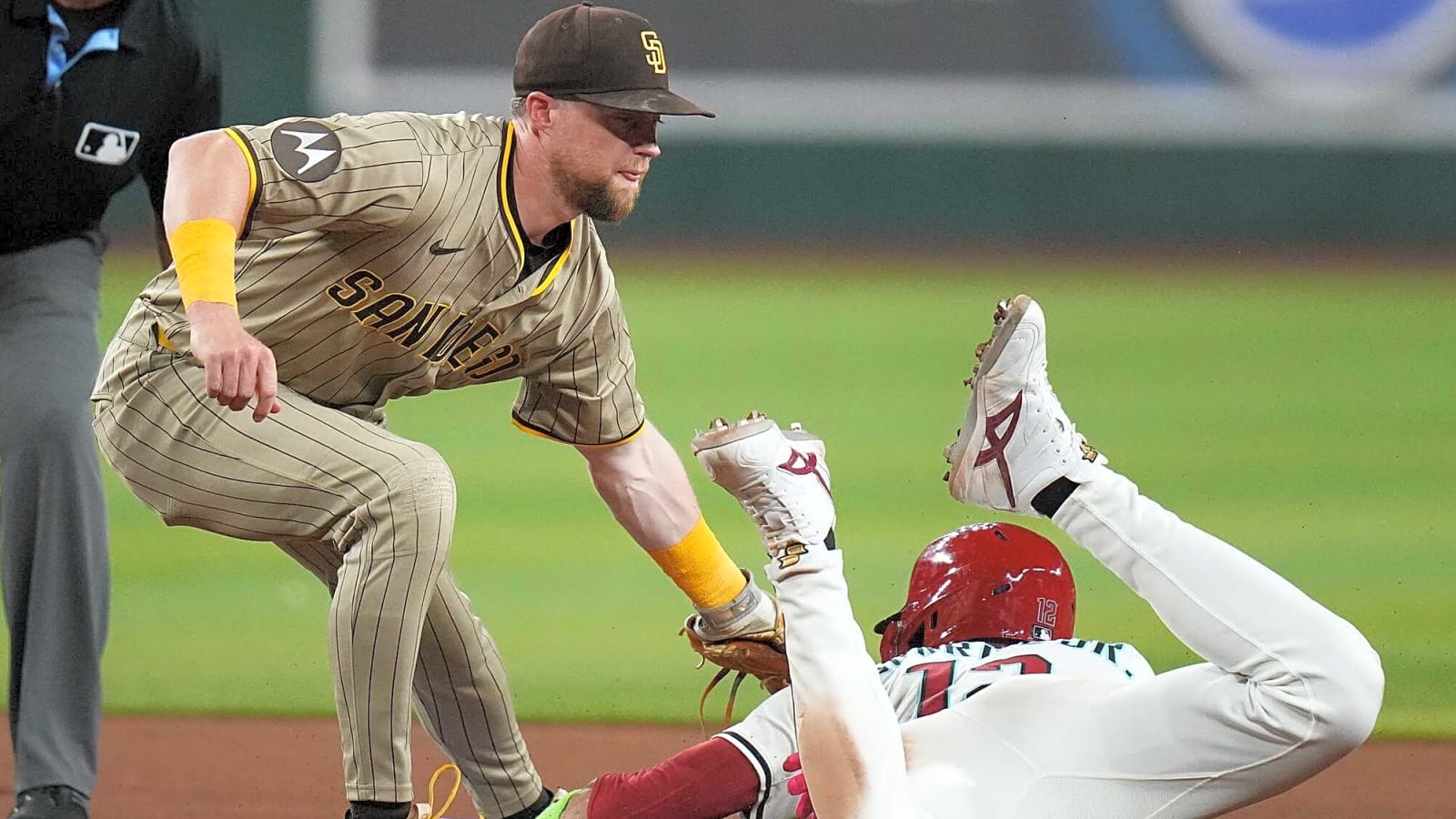 Jake Cronenworth tags out Lourdes Gurriel Jr. at second base on Aug. 4, 2025, at Chase Field.