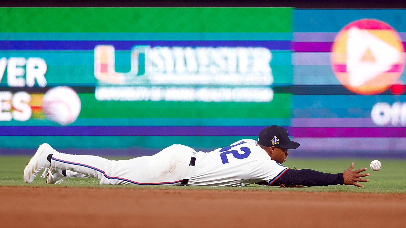 Miami Marlins shortstop Xavier Edwards is outstretched prone and in motion as he dives on the ground for a ball against the Arizona Diamondbacks in the April 2025 series