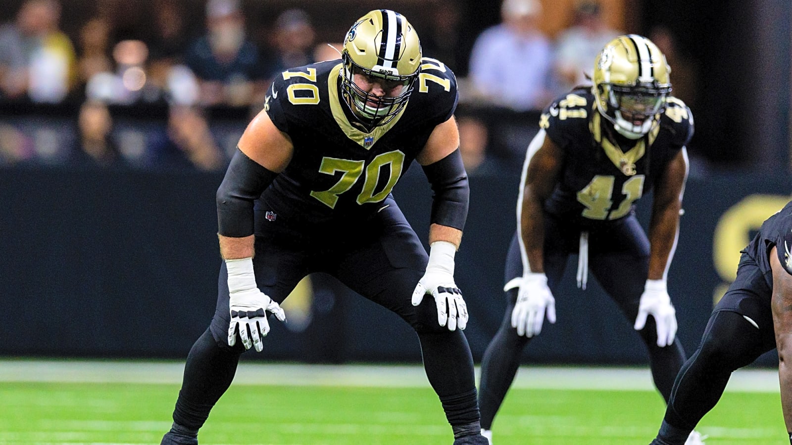 Saints’ Trevor Penning taking snaps at left guard