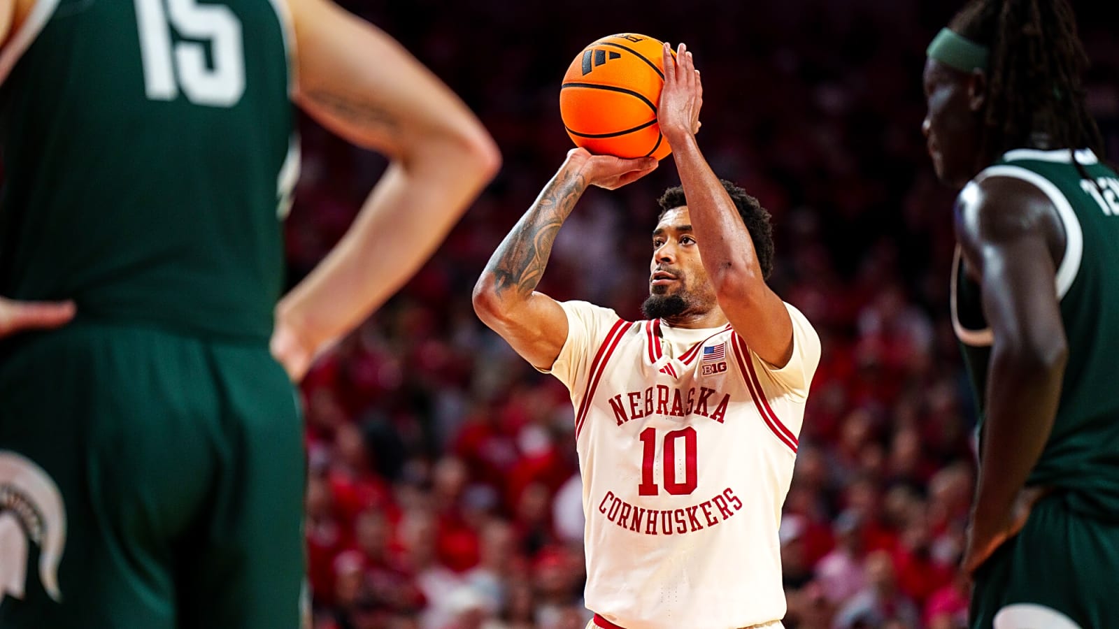 Nebraska pleads with fans: Stop storming the court
