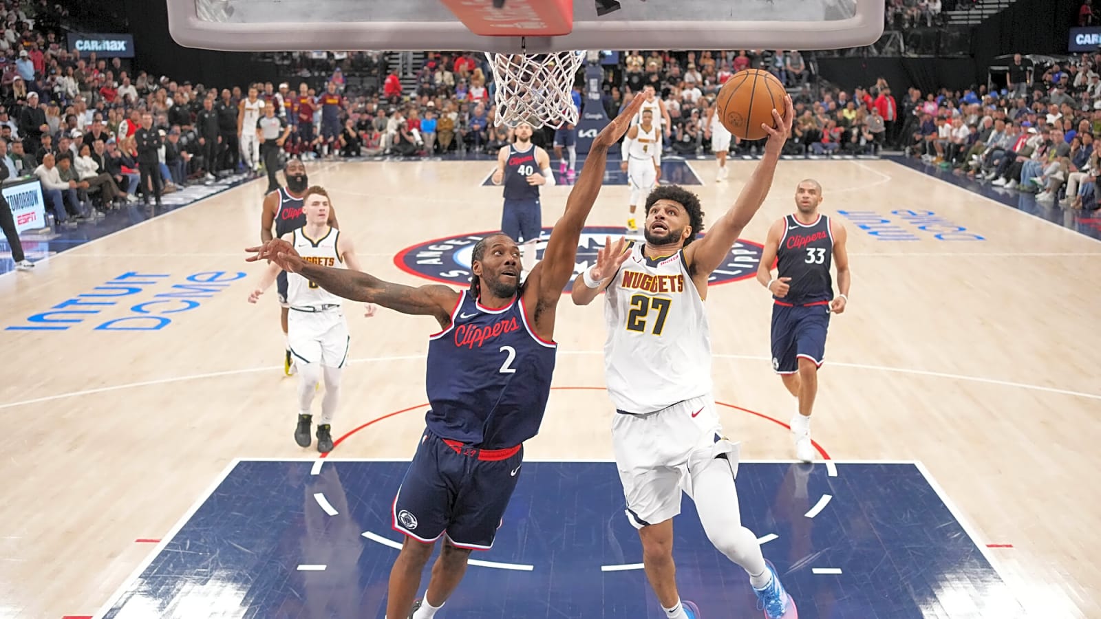 Denver Nuggets guard Jamal Murray shoots the ball against LA Clippers forward Kawhi Leonard underneath the basket in Game 6