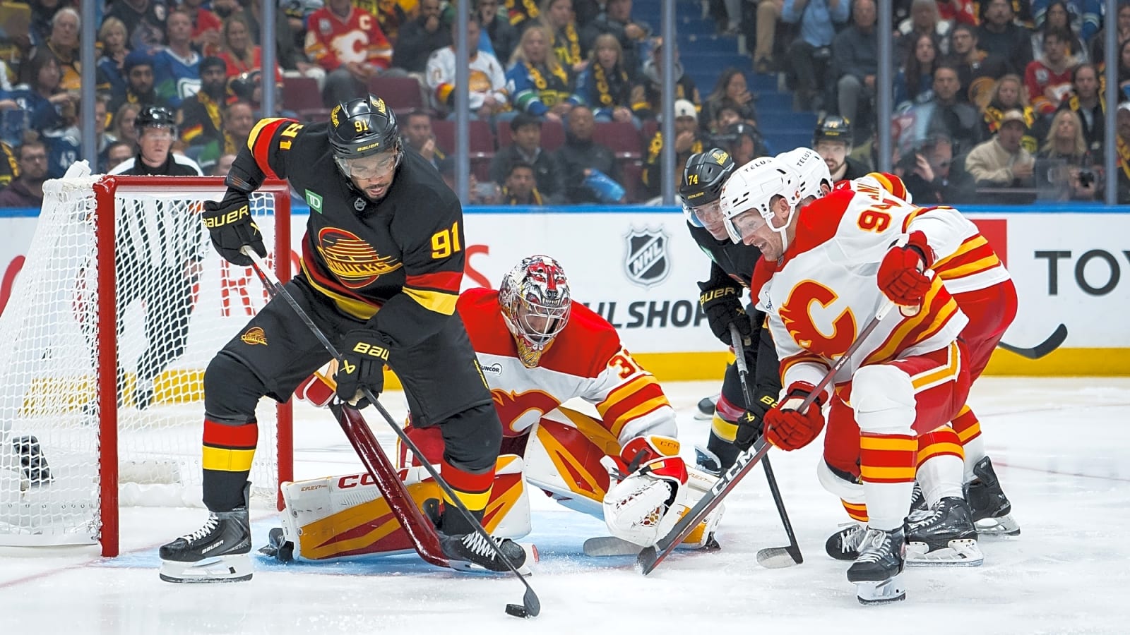 Instant Reaction: Flames fade in loss to Canucks
