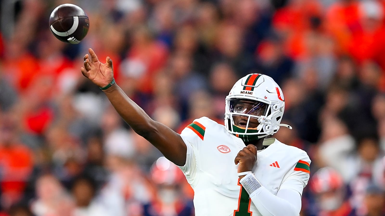 Miami Hurricanes quarterback Cam Ward in motion with the football leaving his hand at a Hurricanes vs. Syracuse college football game
