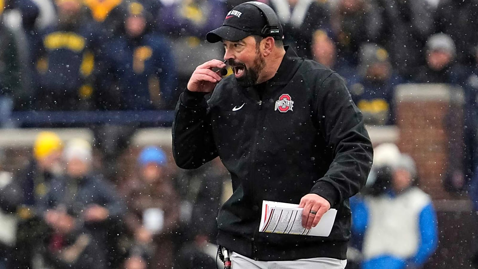 Michigan players guarded their logo after losing to Ohio State