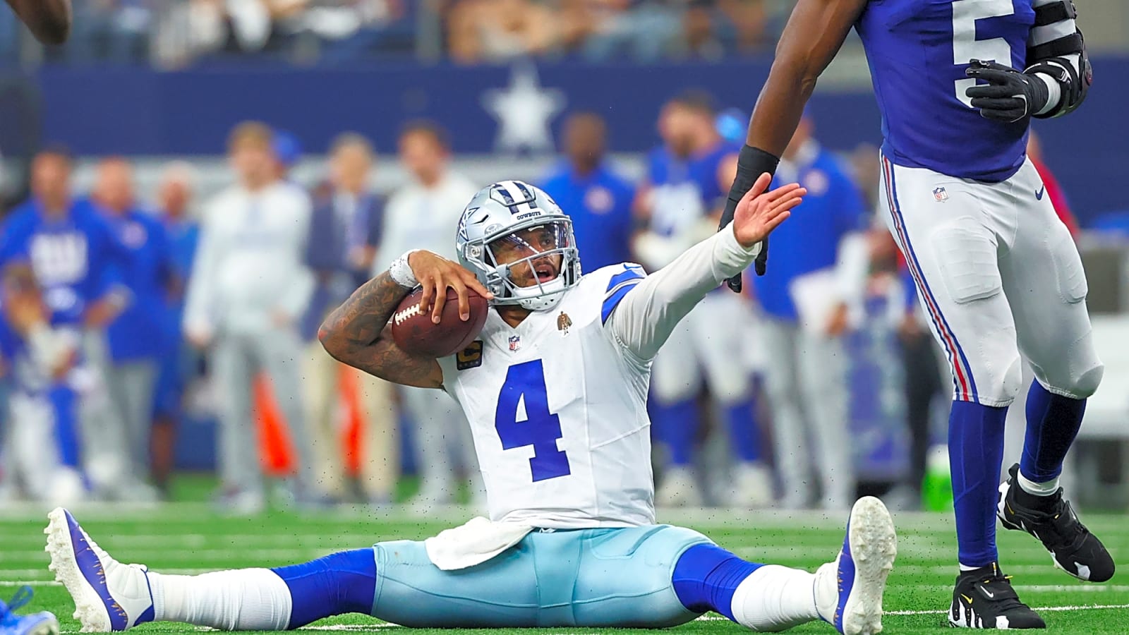 Dak Prescott (4) points to a first down after making a clutch play in overtime vs the New York Giants at AT&T Stadium.