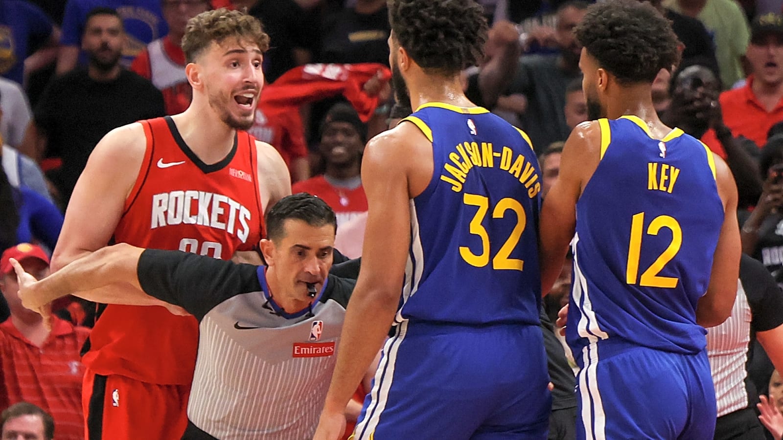 Trayce Jackson-Davis pushes Alperen Sengun during skirmish