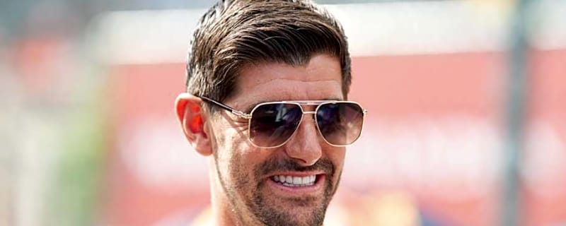 Thibaut Courtois Picks Up Jersey of Real Madrid Icon at Soccer Shop in Belgium