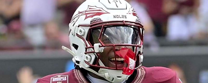 FSU football speedster Micahi Danzy breaks the rock after running by Kent State
