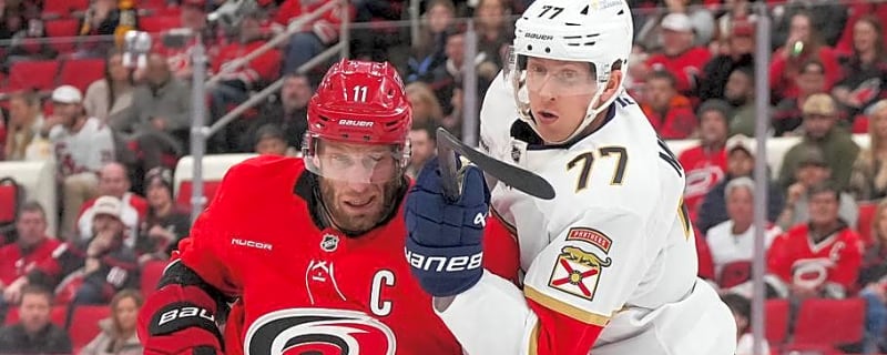 A banner heads to the rafters as the Hurricanes begin their Stanley Cup defense
