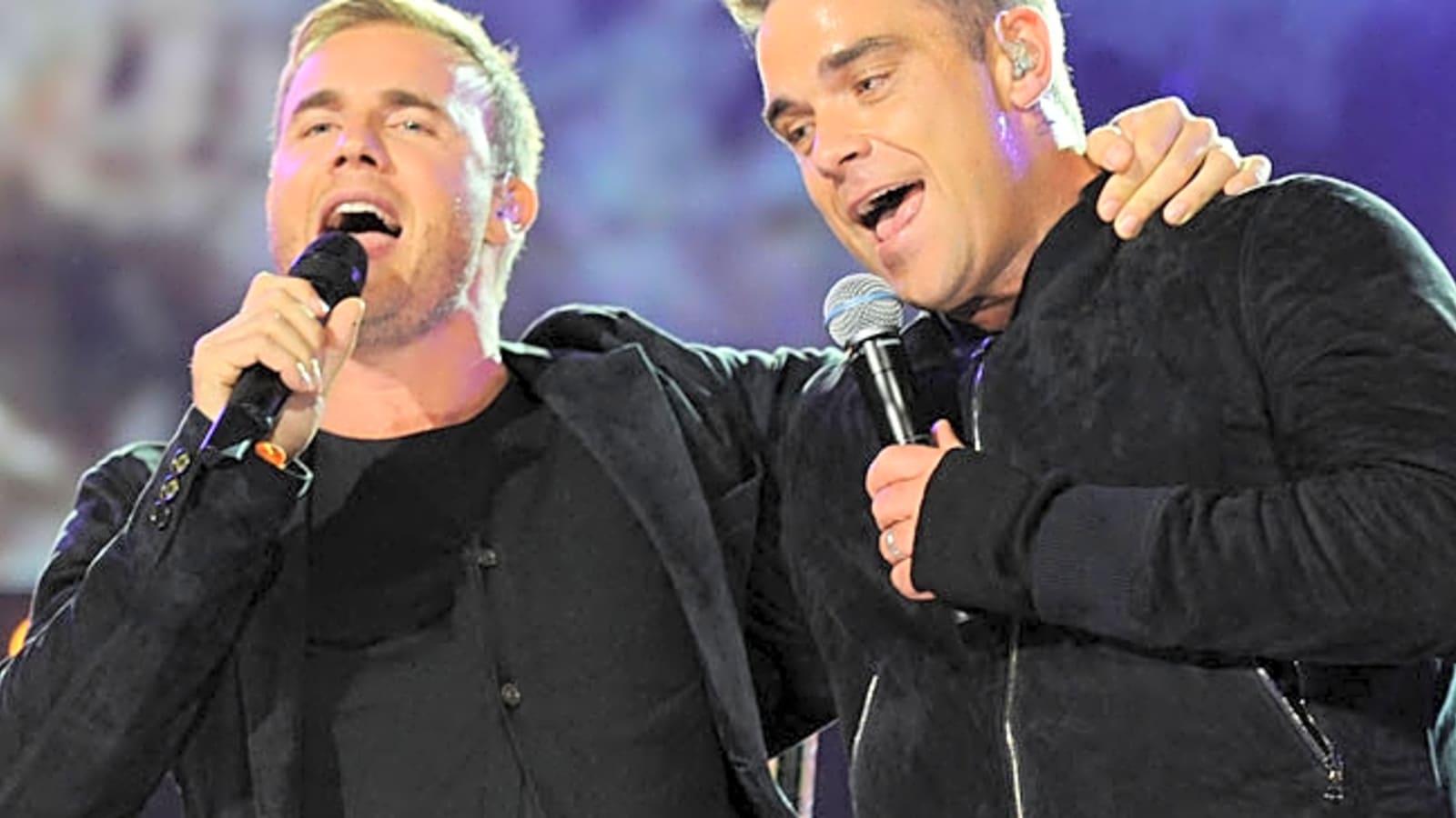 Take That! Robbie Williams and Garry Barlow reunite for first collaboration in over a decade
