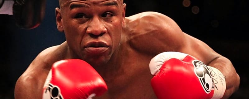 Floyd Mayweather was dropped by unknown challenger as he battled with two injured hands to secure a win