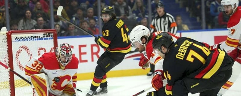 Flames score 5 consecutive goals to surge past Canucks