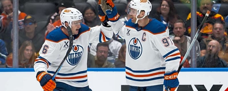 Evan Bouchard, Connor McDavid make waves as Oilers beat Canucks 9-7