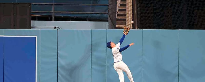 Watch Dodgers’ Kyle Tucker leap over the wall for bonkers robbery vs. Nationals