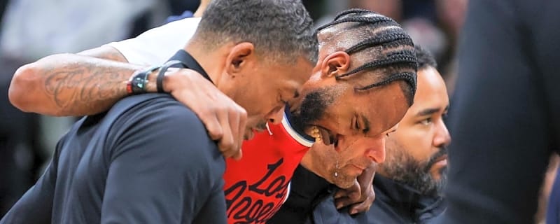 Derrick Jones Jr. carried off court after Jaylen Brown dove into legs