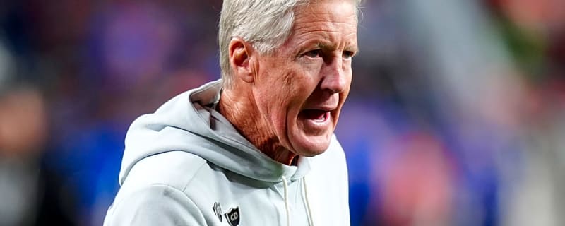 Las Vegas Raiders head coach Pete Carroll pushes over the first domino in what could lead to many more falling over