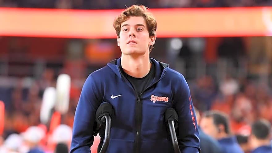 Notre Dame Players Embrace Former Quarterback After Historic Win