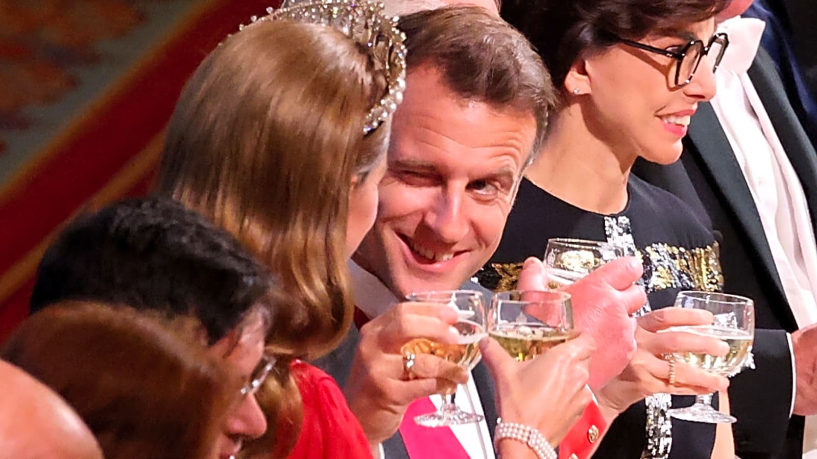 French President Emmanuel Macron winks at Catherine, Princess of Wales during banquet
