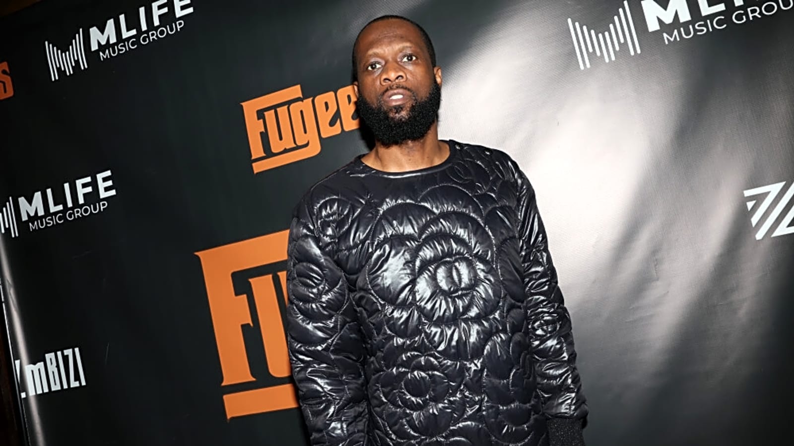 Fugees rapper Pras Michel turns himself in for 14-year prison sentence but will still appeal