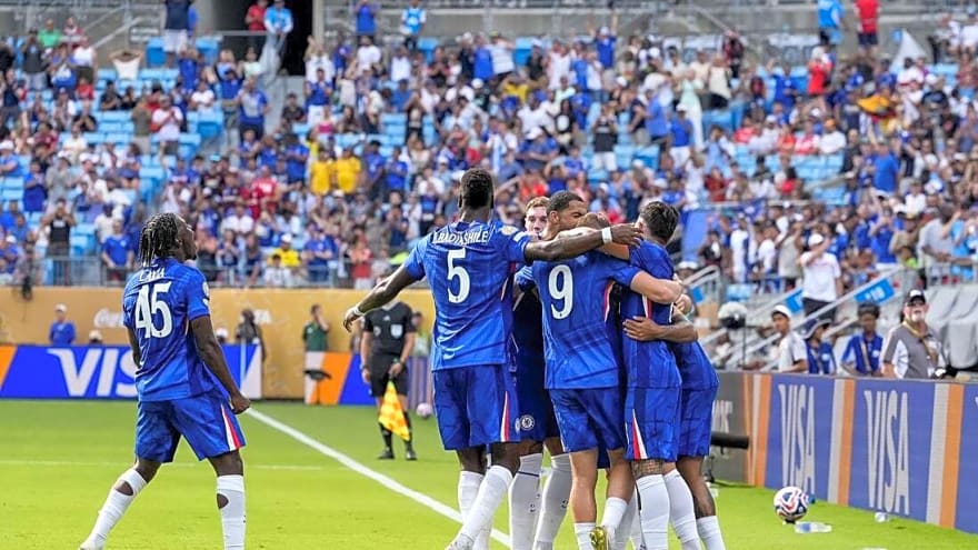 Late goals binge lifts Chelsea over short-handed Benfica