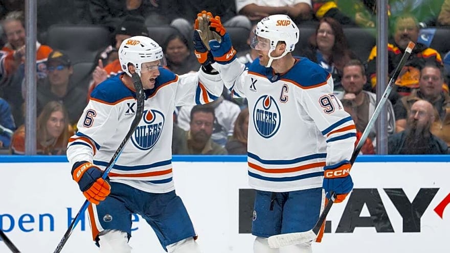 Evan Bouchard, Connor McDavid make waves as Oilers beat Canucks 9-7