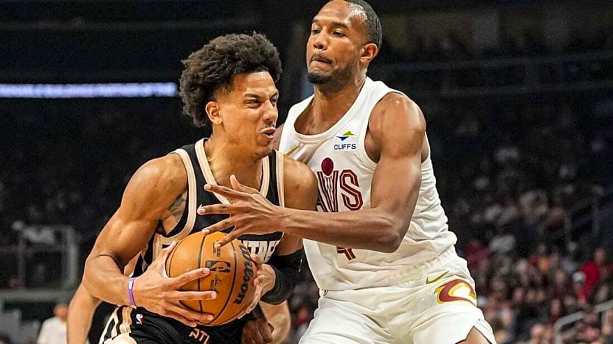 Hawks clinch playoff spot while walloping Cavs