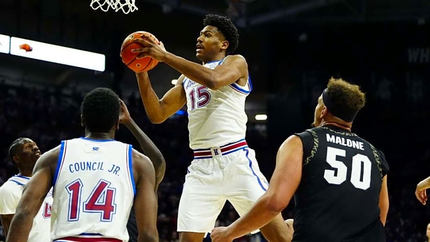Without Bill Self, No. 19 Kansas hangs on to beat Colorado