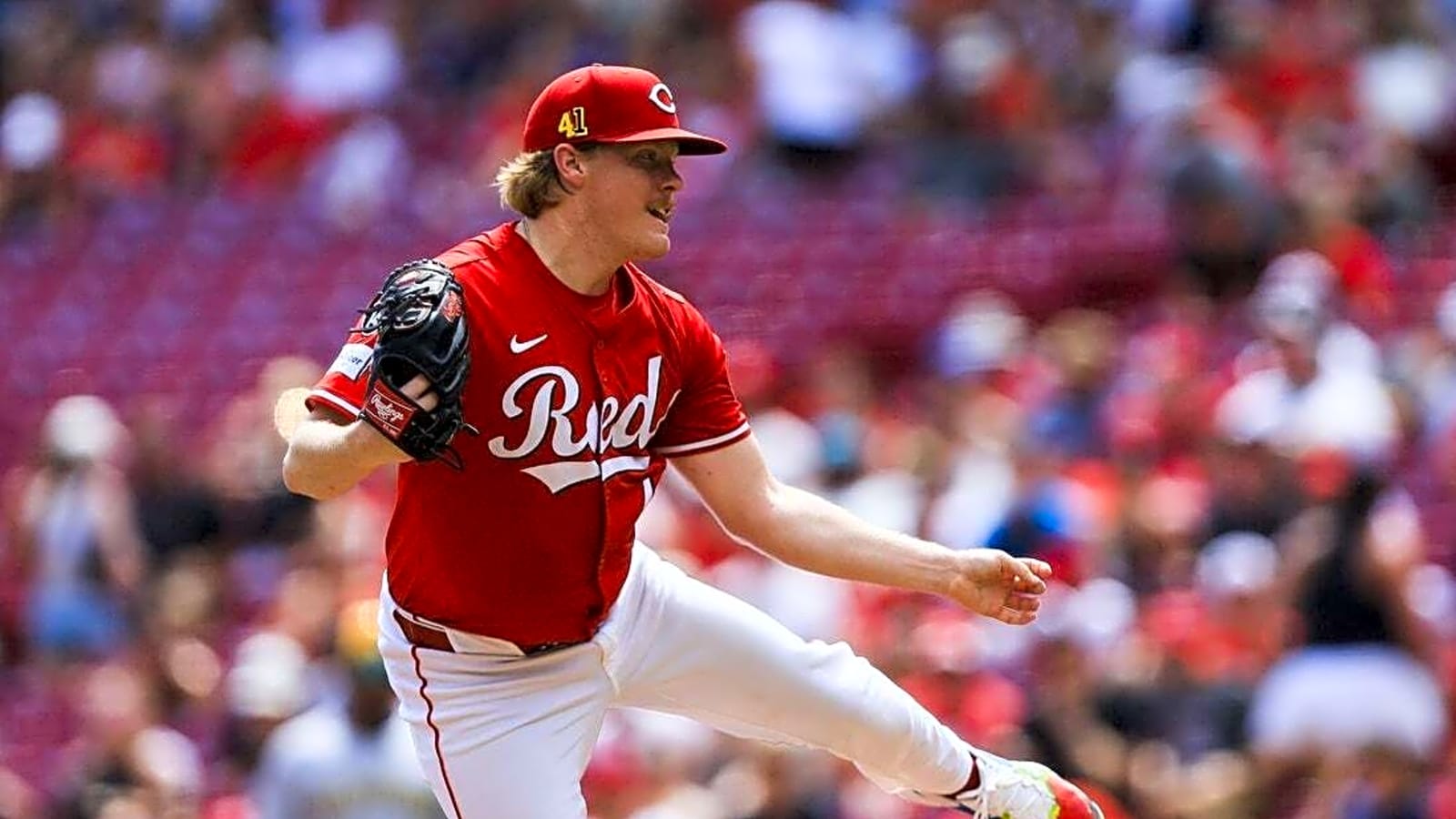 Reds snap Brewers&#39; winning streak in extras