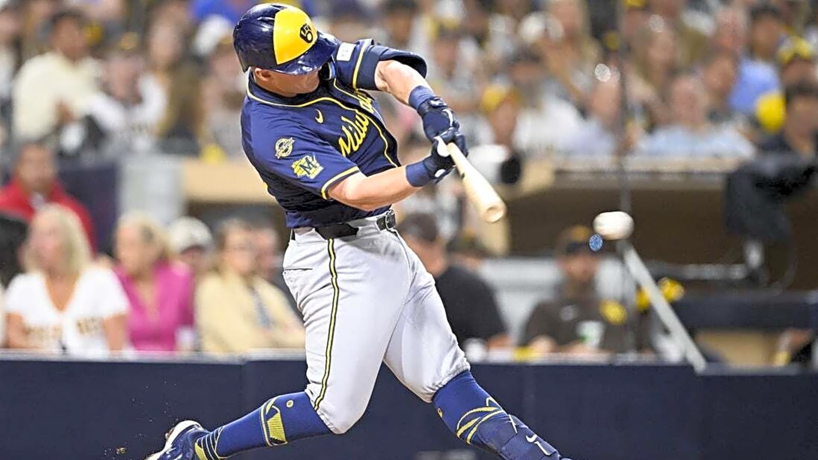Padres edge Brewers in 11th to clinch playoff berth