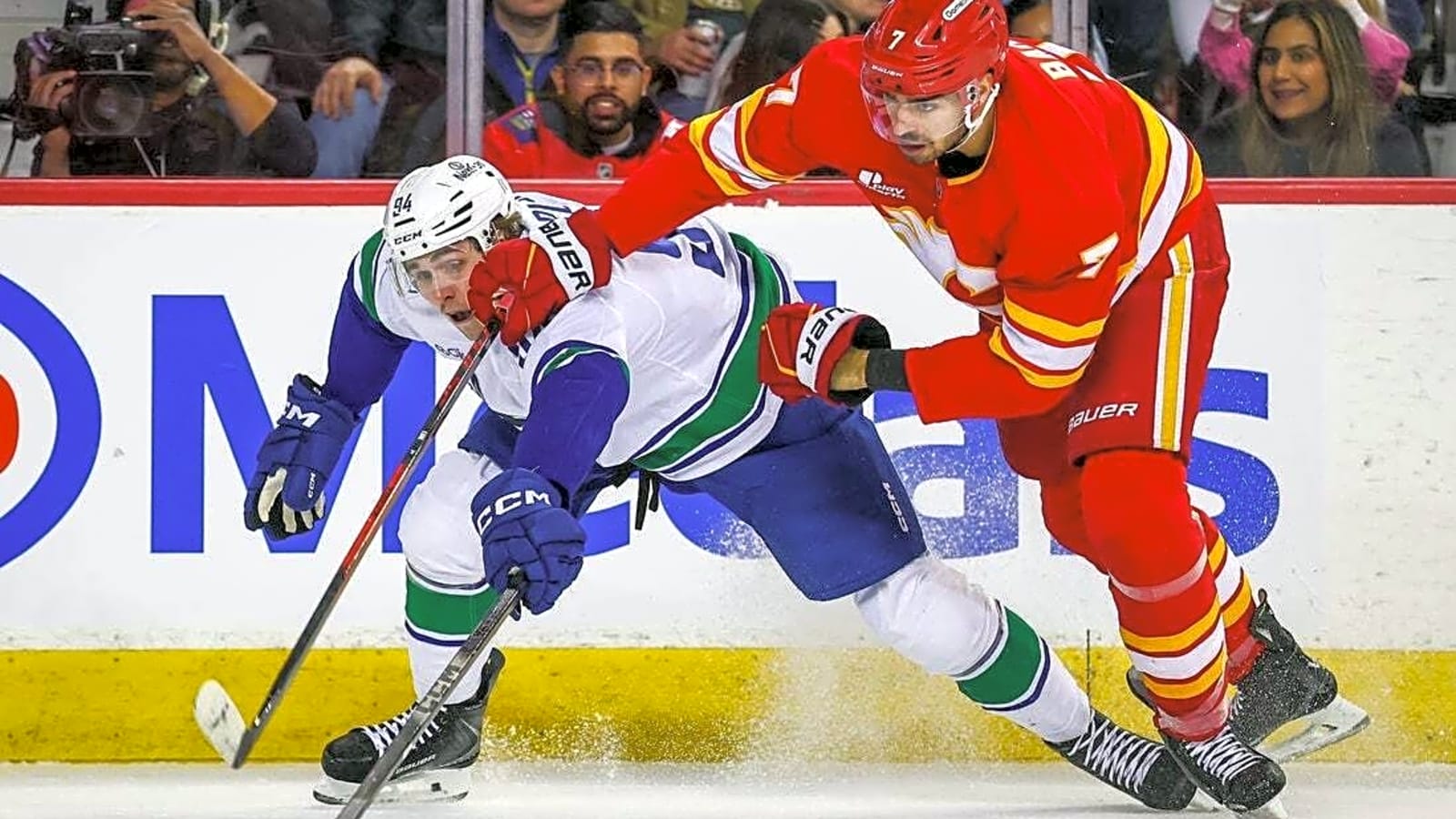 Flames remain hot, beat up on Canucks