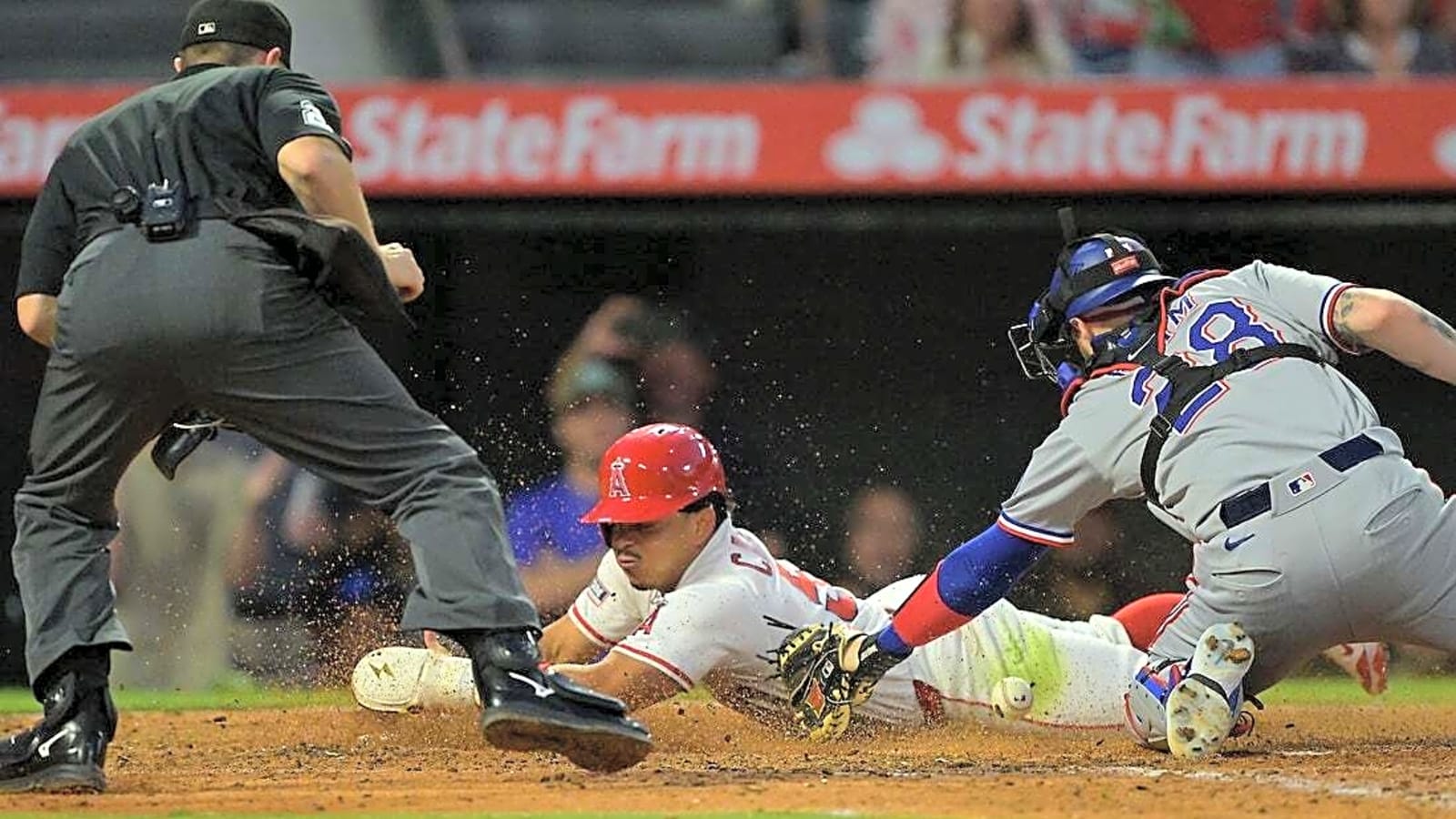 Angels bash three homers, end Rangers&#39; winning streak