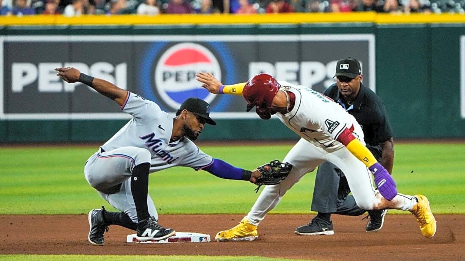 Marlins rally from 4 runs down to beat D-backs in 10 innings