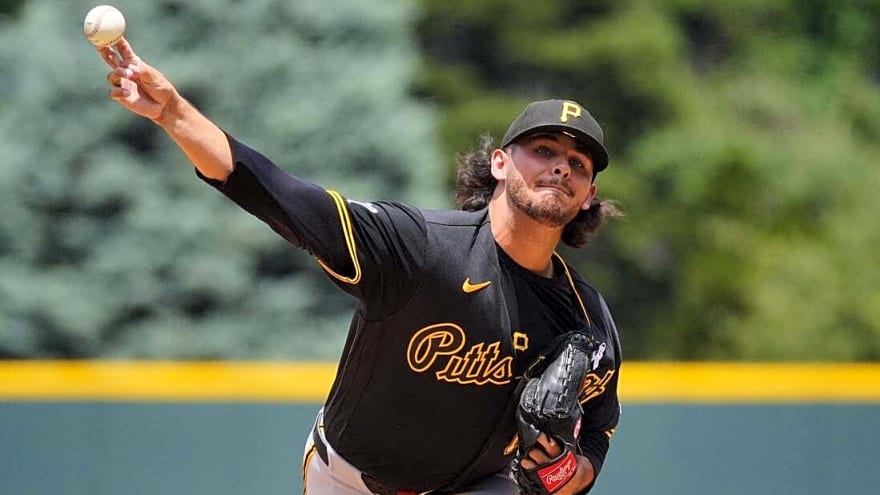 Pirates build big lead, survive late Rockies rally