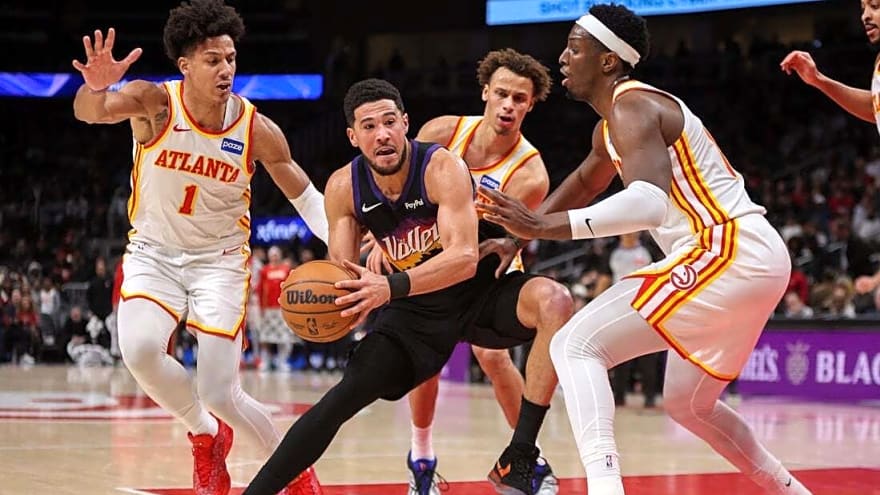 Hawks down Suns after Devin Booker exits with ankle injury