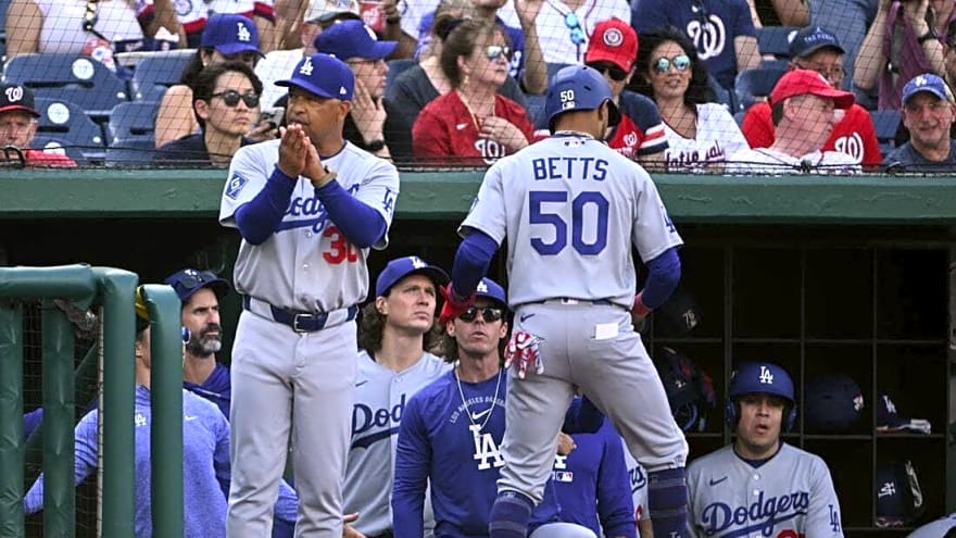 Dodgers SS Mookie Betts (back) exits in first inning vs. Nationals