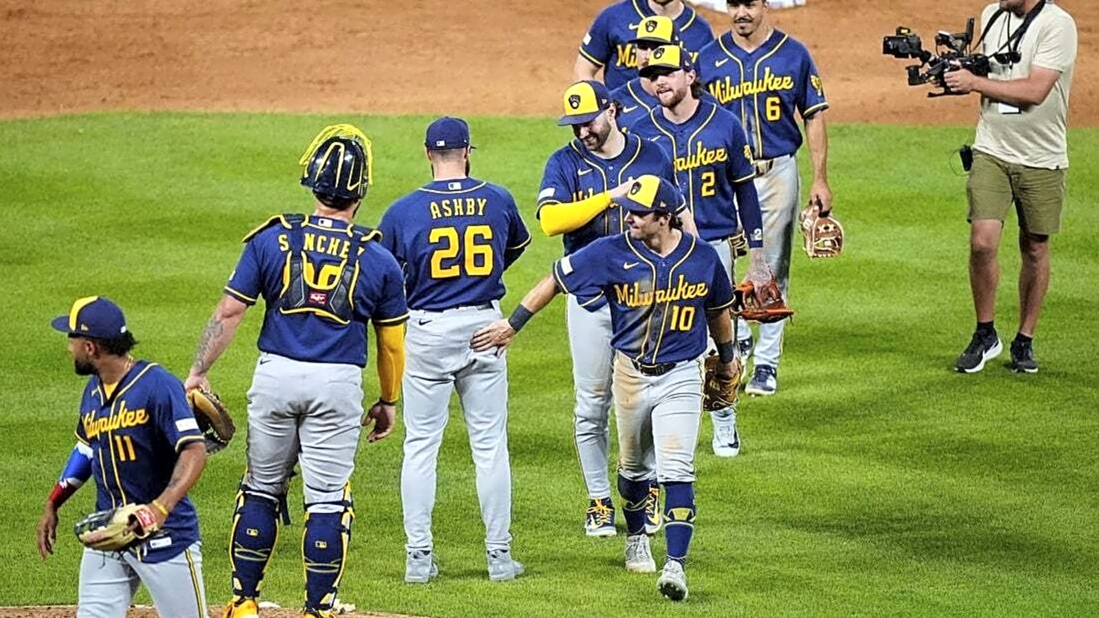 Stifled through 8, Brewers erupt late to sink Rockies in 10