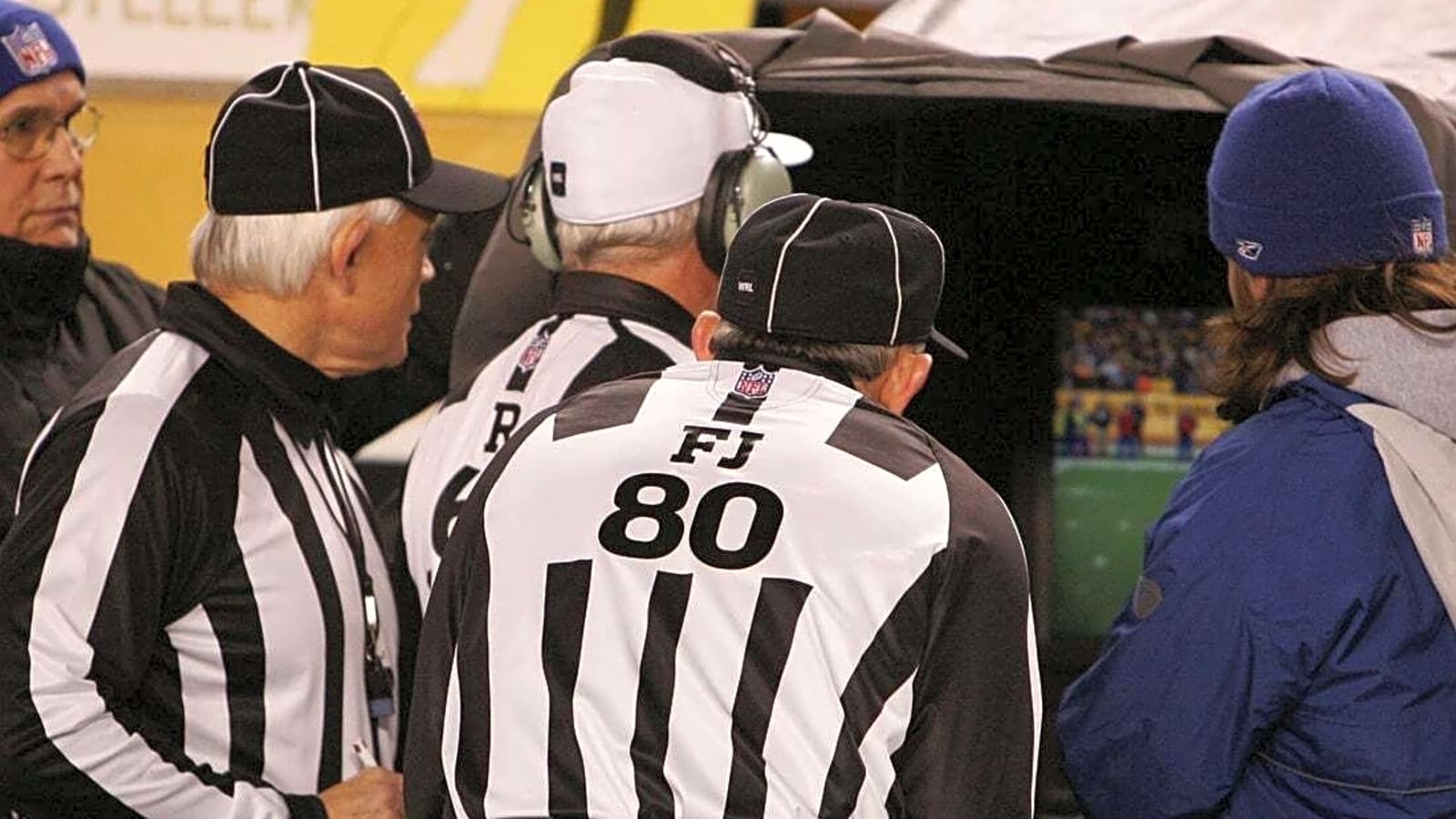 Replay officials throwing flags under consideration