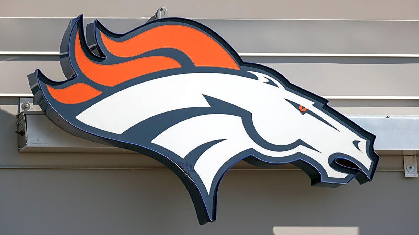 Colorado high school football team shows helmet donated by the Denver Broncos