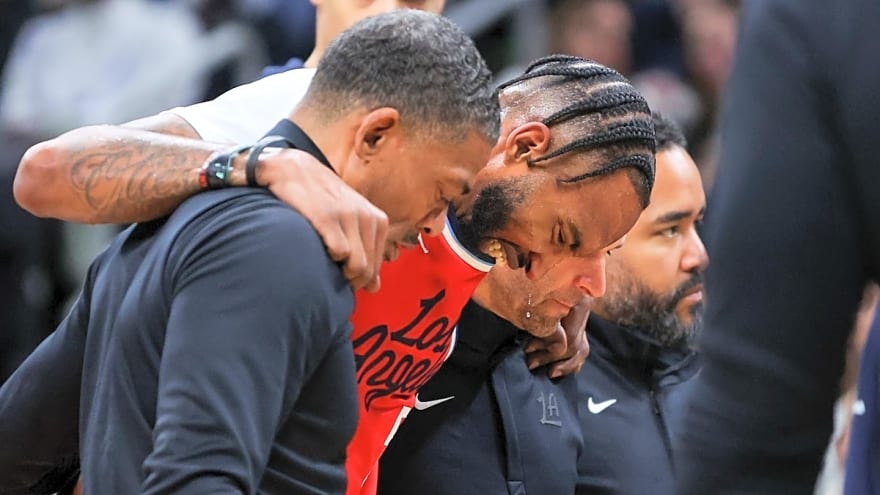 Derrick Jones Jr. carried off court after Jaylen Brown dove into legs