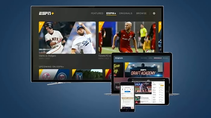 Images of a TV, Laptop, Phone, and Tablet lined up with ESPN Plus streaming, all on a dark blue background.