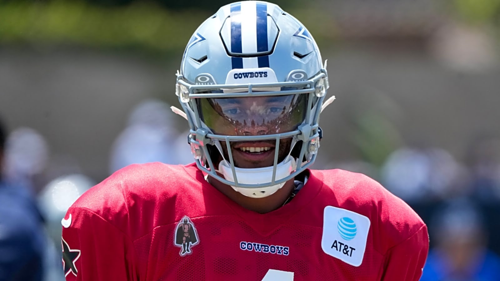 Dallas Cowboys QB Dak Prescott shows off the result of a bet that he lost to Joe Milton III
