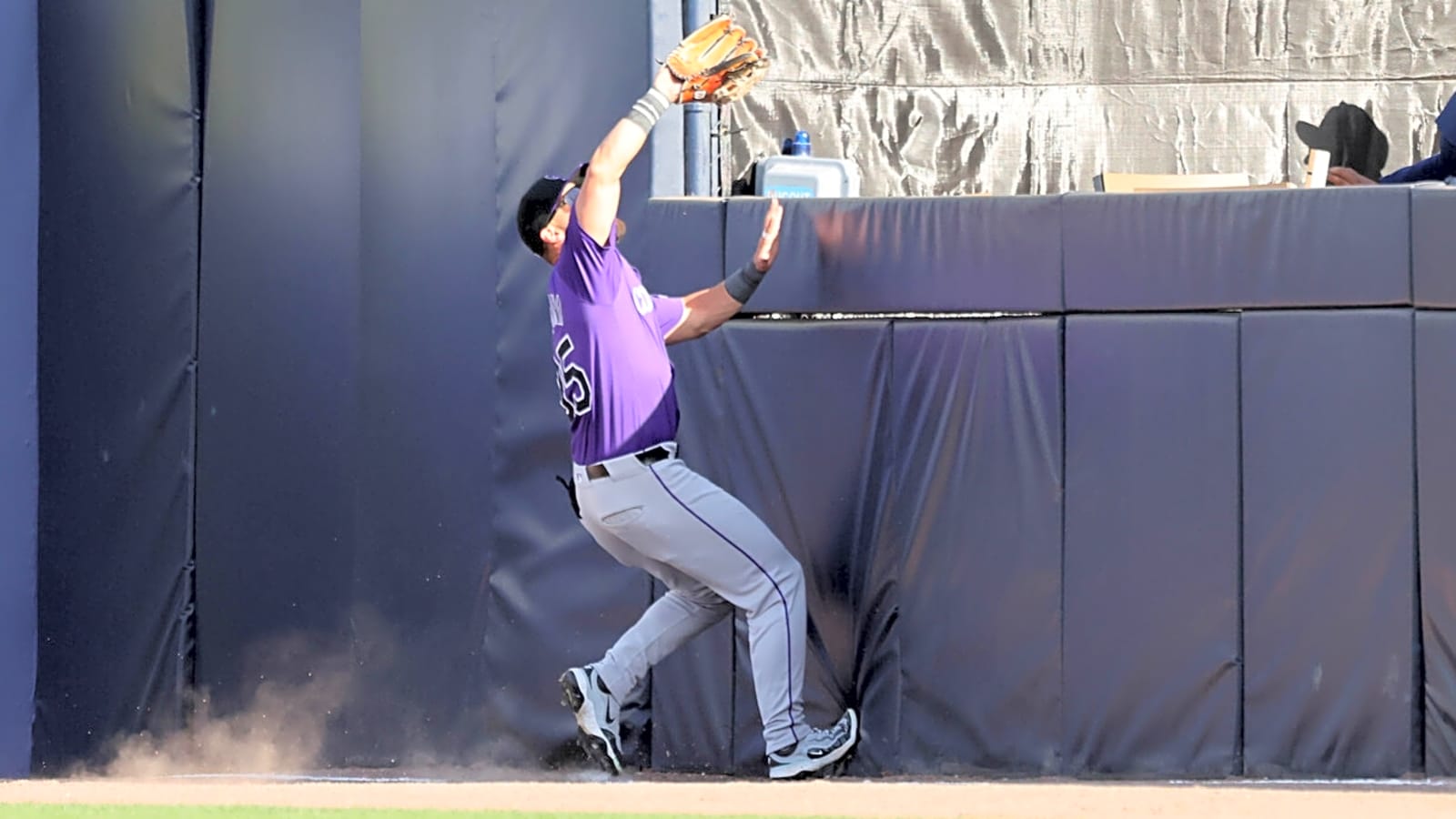 Watch: Rockies outfielder makes acrobatic catch to save fan