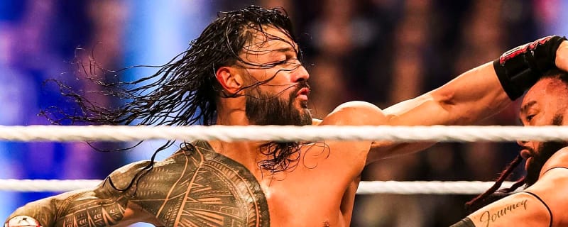 Roman Reigns Flattens CM Punk Through the Announcer Desk as Bills’ Dion Dawkins Reacts